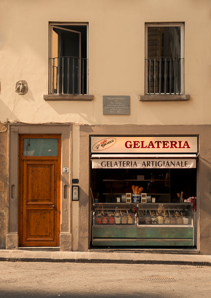 Italian Gelateria with a wooden door and balcony above